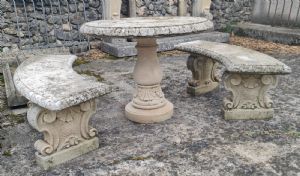 Round stone table with two semi-circular benches